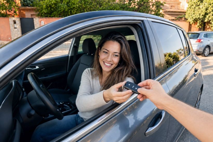 Buyer receiving the keys to a car in Spain